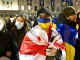 Молодой человек в флаге Грузии + Украина — символ братства и солидарности.